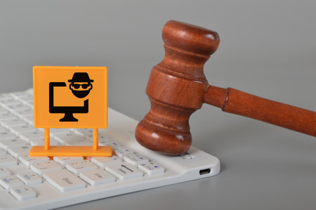 Computer keyboard, judge gavel and scammer symbol. Email phishing attack concept.