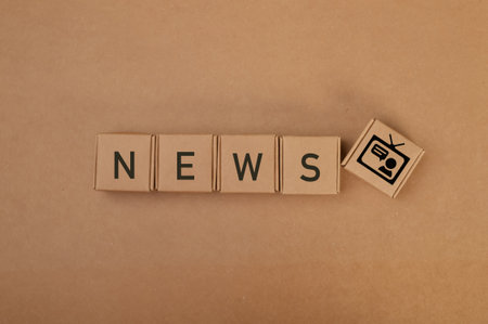 Cardboard boxes with text NEWS.の写真素材