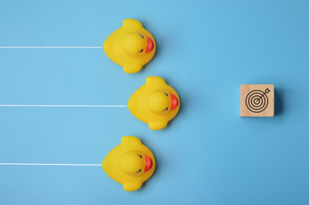 Toy ducks heading to the target. Ambition and challenge to achieve success concept.の写真素材