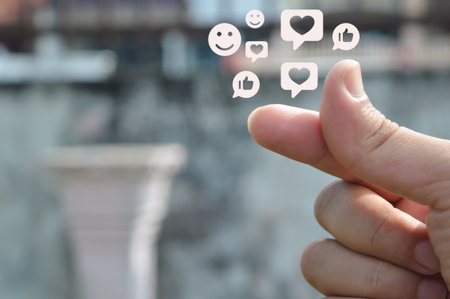 Human finger with smile, like and love symbols. Social media concept.の写真素材