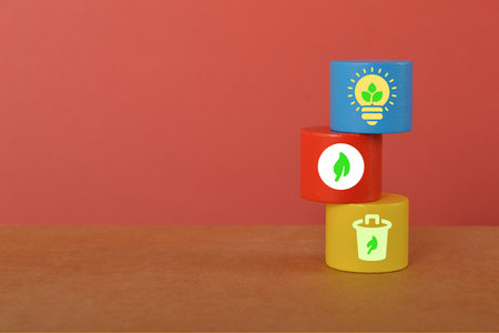Colorful wooden block with sustainable energy symbols.の写真素材