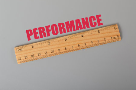 Wooden ruler with text PERFORMANCE.. Performance concept.の写真素材