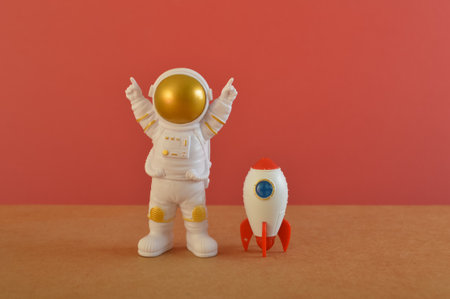 Toy rocket with astronaut. Space man, Kid dream flying, childhood, freedom, travel, future conceptの写真素材
