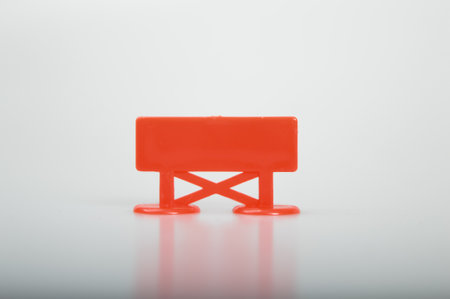 Black red plastic sign isolated on a white background. Copy space for the text.