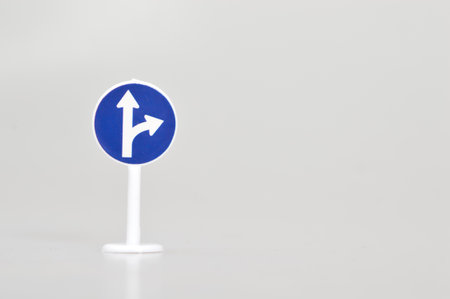 Compulsory ahead or right turn sign with a white background. Traffic signs and symbols