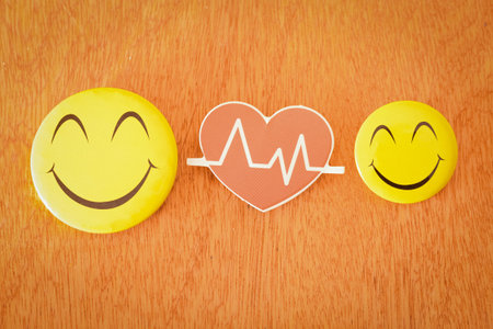A happy face emoticon with health symbol. Keeping healthy life style concept.の写真素材