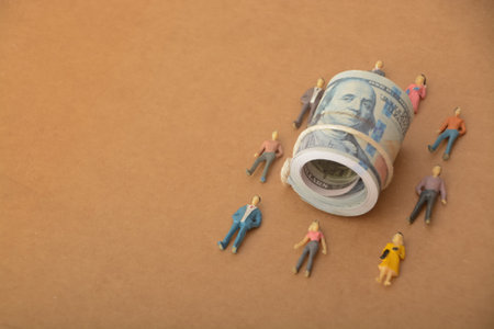 team of professionals, strategizing and discussing financial opportunities, with currency notes, symbolizing their collective efforts to maximize their wealthの写真素材