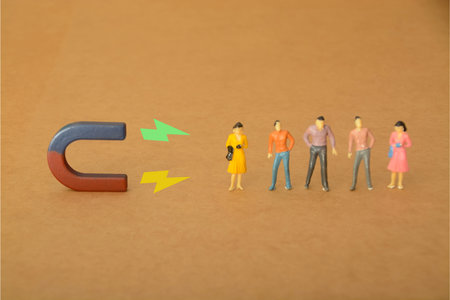 magnet picking the perfect new team member, emphasizing the power of attraction in talent acquisitionの写真素材