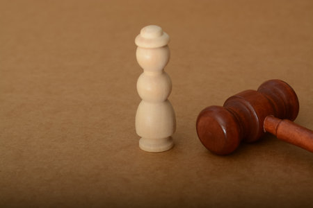 the judge's gavel stands ready to deliver justice, weighing the actions of a corrupt businessmanの写真素材