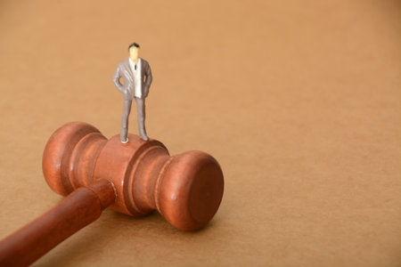 the judge's gavel stands ready to deliver justice, weighing the actions of a corrupt businessmanの写真素材