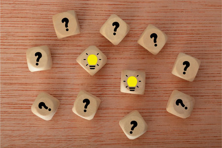 a question mark dangled like a key, waiting for the moment of inspiration to turn the lock and illuminate the room with the light bulb of a brilliant idea.の写真素材