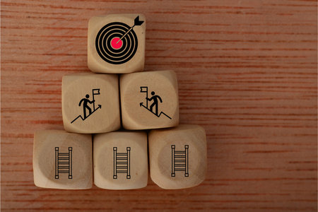 Determination individuals aim high, envisioning success as they climb the stairs towards their target, a well-aimed dart hitting the bullseye on a dartboard.の写真素材