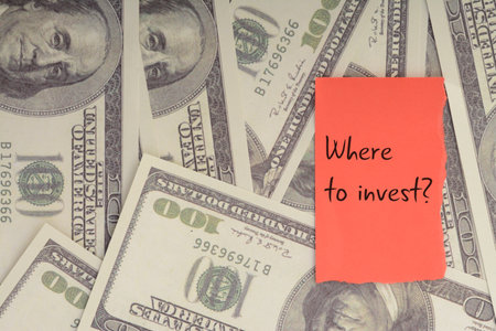 Money banknotes with question WHERE TO INVEST?. generating returns or achieving specific financial goalsの写真素材