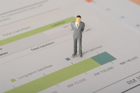 The businessman closely analyzed the sales graph to identify growth opportunities and make informed business decisionsの写真素材