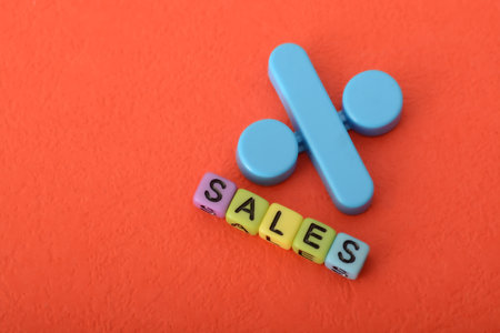 Alphabet beads with text SALES and percentage symbol. Sales refer to the process of selling products or services to customers in exchange for paymentの写真素材