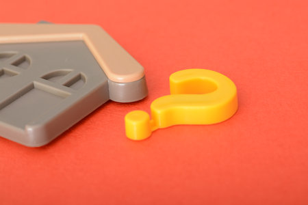 The presence of a question mark symbol in the property documentation raised uncertainties about the house's value and consequently its price in the market.の写真素材