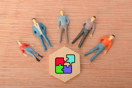 In unity, people act as pieces of a jigsaw puzzle, each contributing through cooperation, creating a stronghold of strength and resilienceの写真素材