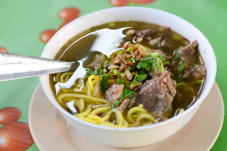 A popular Malaysian dish, this bowl features Chinese noodles immersed in a flavorful Asian soup with...
