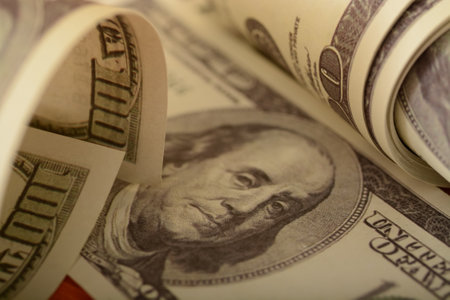 Close-up view of money banknotes, exemplifying financial security and success, wealth.