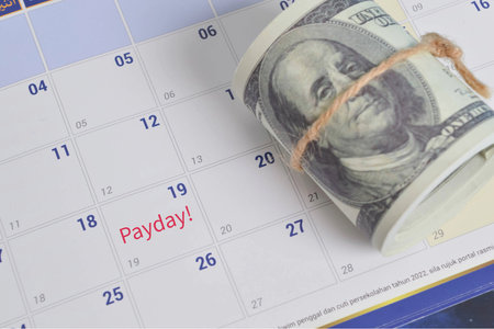 Payday refers to the day on which an employee receives their salary or wages from their employer for the work they have performed over a specific periodの写真素材
