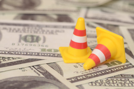 The image symbolizes the potential financial roadblocks or delays that can arise in unexpected situations.の写真素材