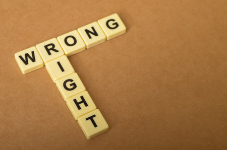the contrast between right and wrong, with the letters forming the words "RIGHT" and "WRONG" arranged in a conflicting manner.の写真素材