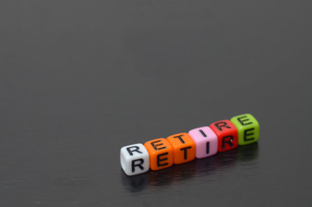 the beads with words RETIRE suggests a journey towards a new phase of life, filled with opportunities for relaxation, exploration, and personal growth.の写真素材