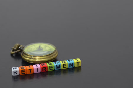 the beaded word "RETIREMENT," symbolizes the passage of time and the importance of planning for the future.の写真素材
