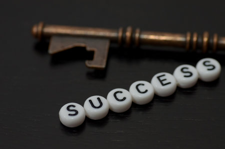 the beaded word "SUCCESS," symbolizes the unlocking of potential and the pursuit of personal achievement.の写真素材