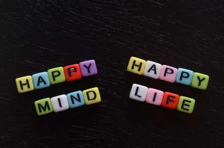The colorful beaded words HAPPY MIND HAPPY LIFE convey a powerful message about the