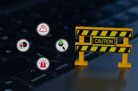 The caution sign, surrounded by symbols representing online threats, serves as a stark warning of the potential dangers lurking in the digital world.の写真素材
