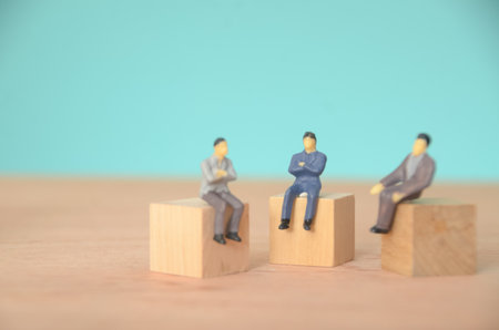 Sitting together in a conference room, the businessman and his partner exchanged ideas to align their goals and achieve their target.の写真素材