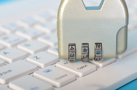 The combination lock represents the need for robust cybersecurity in today's digital world, where data breaches and cyberattacks are prevalent.の写真素材