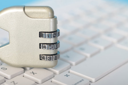 The combination lock represents the need for robust cybersecurity in today's digital world, where data breaches and cyberattacks are prevalent.の写真素材
