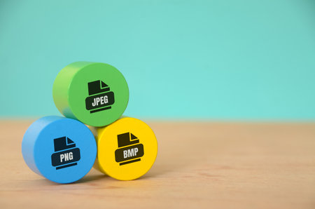 The arrangement of the three blocks, labeled "JPEG," "PNG," and "BMP," symbolizes the diversity of image file formats commonly used in digital photography and graphic design.の写真素材