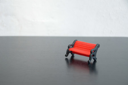 The bench's weathered appearance hints at a history of use and experiences, suggesting tales of joy, sorrow, or simply passing time.の写真素材