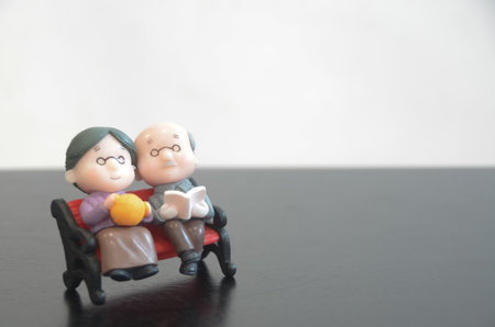 The image depicts the delicate balance between financial security and the enjoyment of life in old age, suggesting that both are essential for a fulfilling retirement.の写真素材