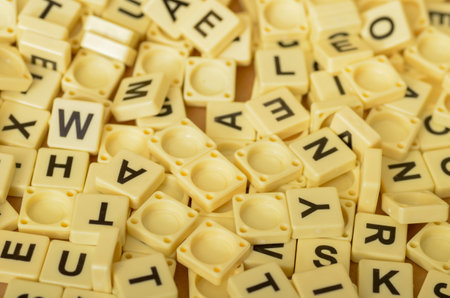 The Scrabble letters are a popular tool for word games and puzzles, often used for educational and entertainment purposes.の写真素材