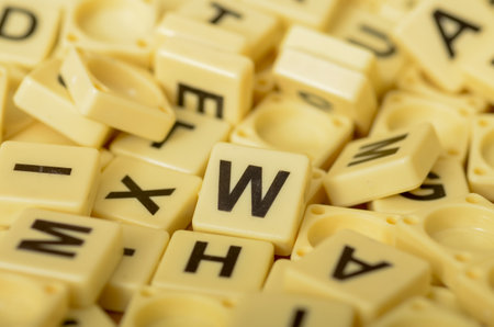 The Scrabble letters are a popular tool for word games and puzzles, often used for educational and entertainment purposes.の写真素材