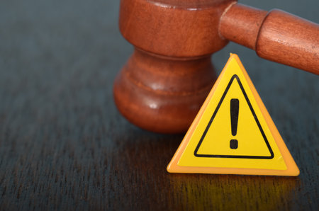 Justice in Action: The Gavel and Warning Sign Symbols of Authority and Caution