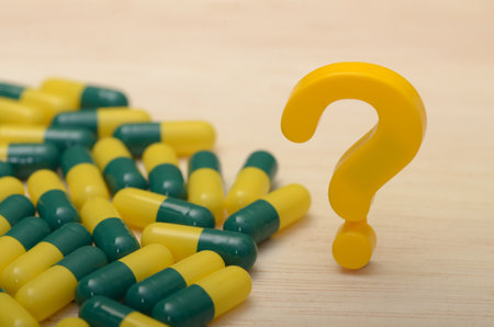 Exploring Unanswered Questions with Pill Capsules: A Symbol of Curiosity and Discoveryの写真素材