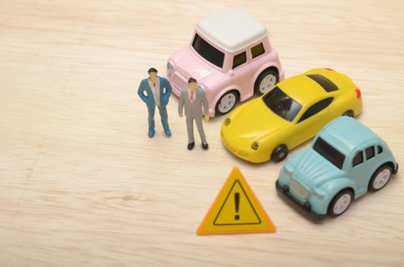 Business People Warning About Car Scam Alert with Serious Discussion and a Warning Sign