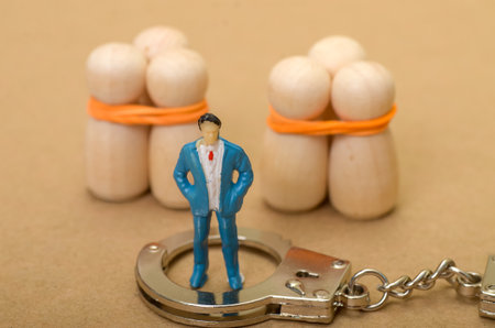 Businessman in Handcuffs Facing Justice: Detainee Victim Story of Corruption and Accountabilityの写真素材