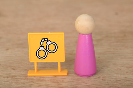 Justice and Detention Concept: Human Figure with Handcuffs Symbolizing Law and Accountabilityの写真素材