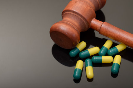 the gavel and the pills creates a powerful visual metaphor for the intersection of law and medicine.の写真素材