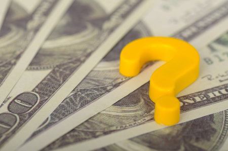 The image visually represents uncertainty or questions surrounding financial matters.の写真素材
