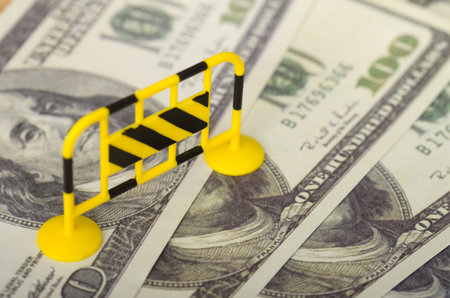 The image visually represents potential roadblocks or obstacles in the financial world, such as economic downturns or financial crises.の写真素材