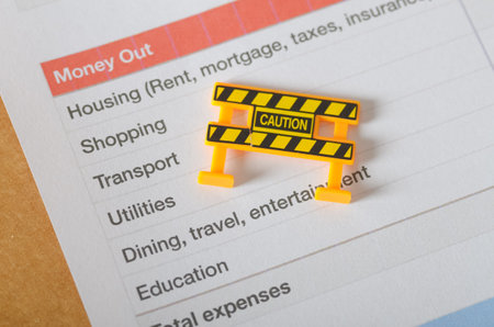 Caution in Budgeting: Financial Planning Warning Sign on Expense Worksheetの写真素材