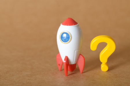 Rocket and Question Mark Symbolizing Ambition and Uncertaintyの写真素材
