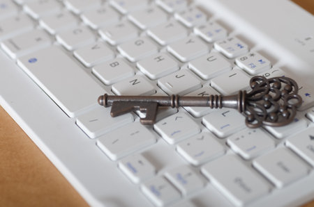 Digital Security Concept: Antique Key on Laptop Keyboardの写真素材